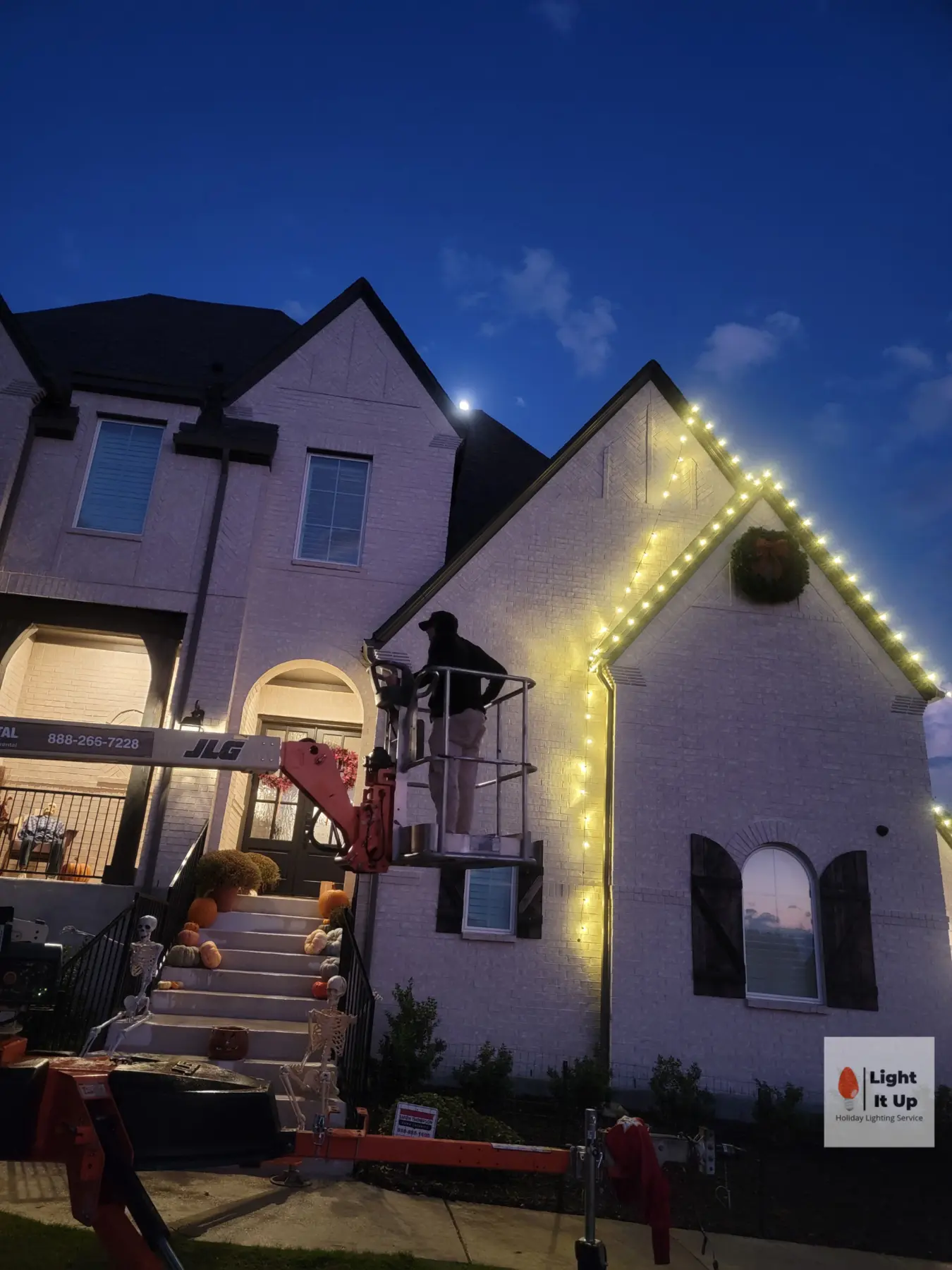 Light It Up Holiday crew installing custom roofline lights