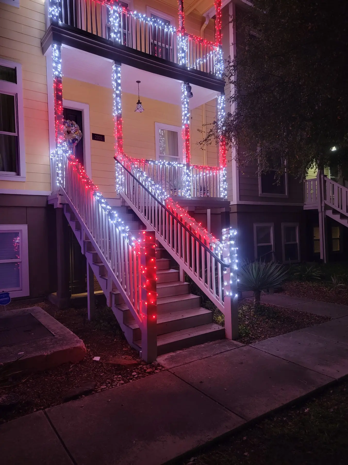 Holiday lighting technician working safely from a lift
